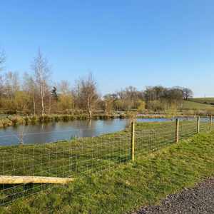 Fence betwwen the wedding & events field & lake in worcestershire