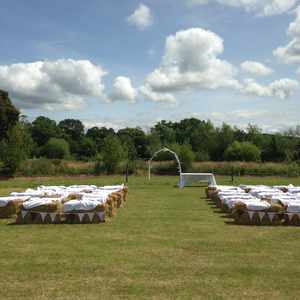 Covered hay bales ceremony opposite the lake