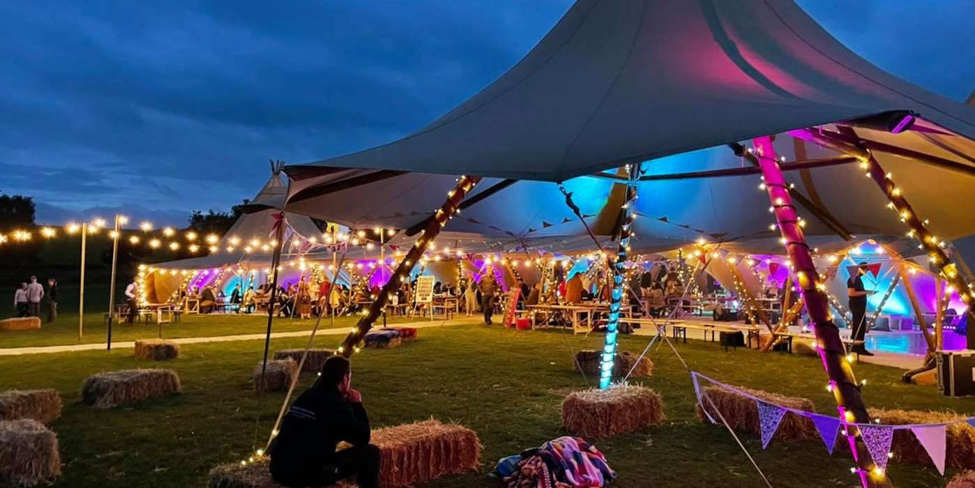 Tipis Lit Up - Festival Wedding - Alcott Weddings