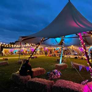 Tipis Lit Up - Festival Wedding - Alcott Weddings.jpg